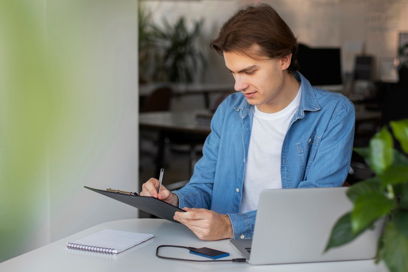 A professional reviewing documents with AI assistance